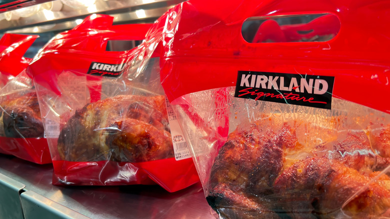 Bags of Costco Kirkland Signature rotisserie chicken at the store