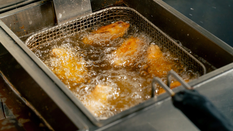 Professional deep fryer in commercial kitchen