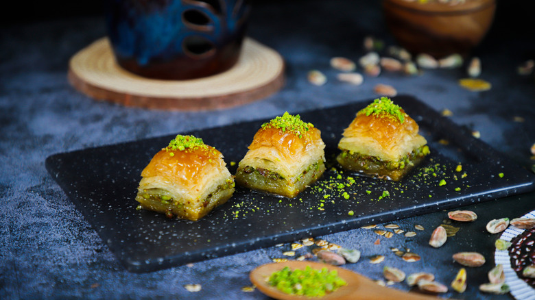 Pieces of baklava on a slate.