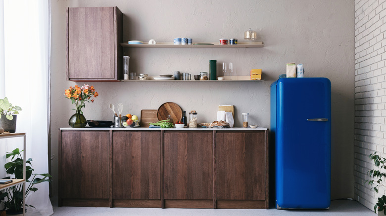 A blue fridge in a modern-style kitchen