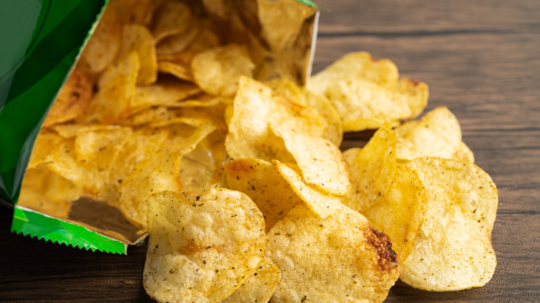 Bag of chips spilled on table