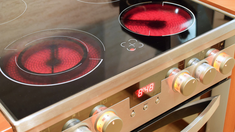 An electric range stove turned on