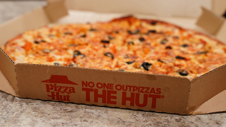 Pizza Hut pizza in a branded pizza box