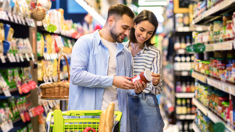 Two people shopping for groceries