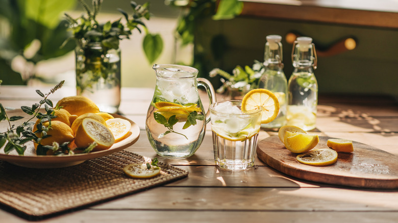 Lemon water pitcher on wooden table