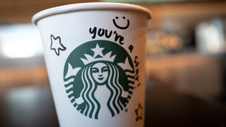 Starbucks coffee cup with logo and 