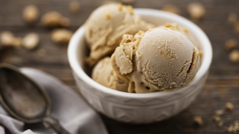 Dish of caramel ice cream and spoon