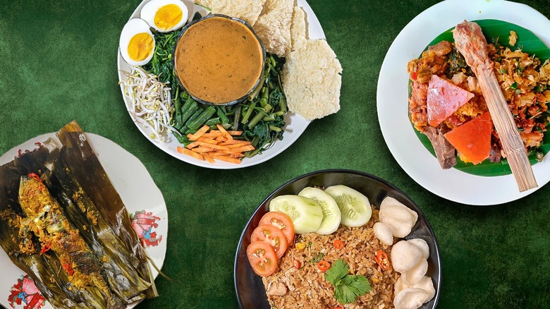 Variety of Indonesian dishes on green background