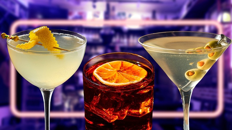 A line of different cocktails with a purple background