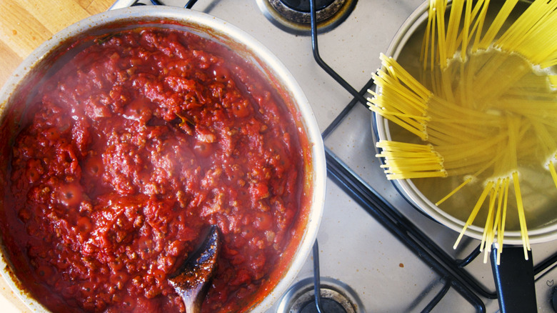 Tomato sauce simmering in pan.
