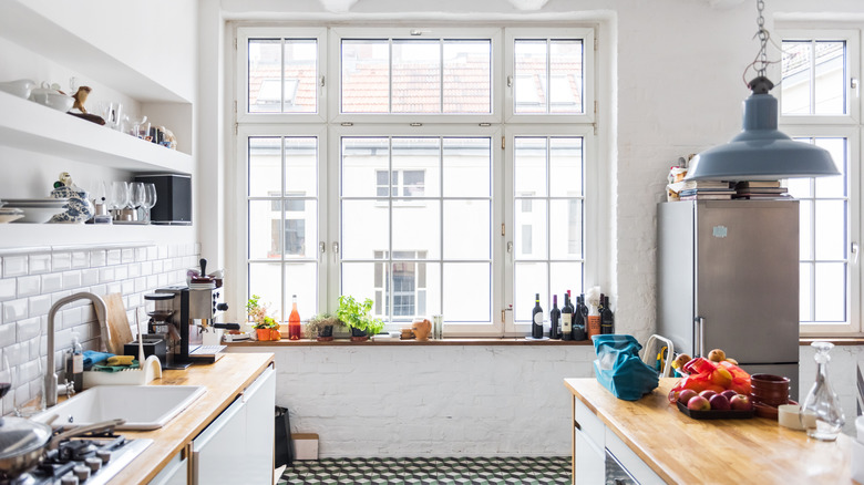 bright kitchen with tall windows in center