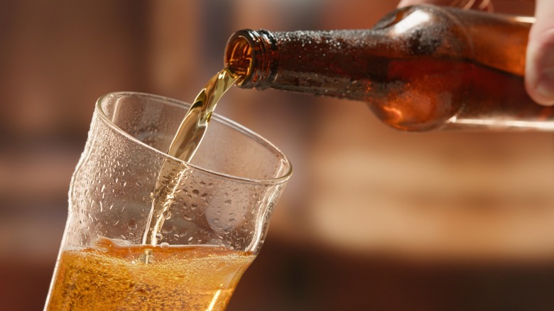 Pouring a bottled beer into a glass