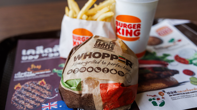 whopper on a tray with fries and drink
