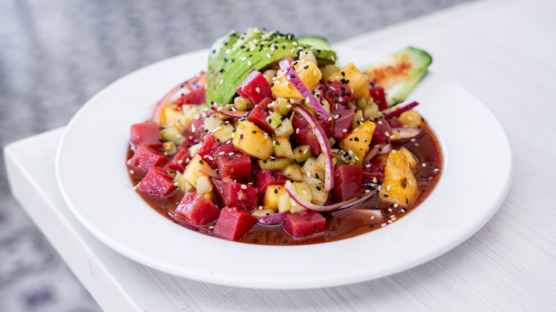 A plate of Mexican tuna ceviche with mango, red onion, and avocado