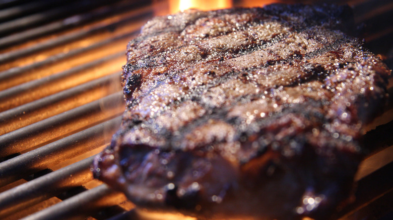 Close-up of ribeye steak on a grill