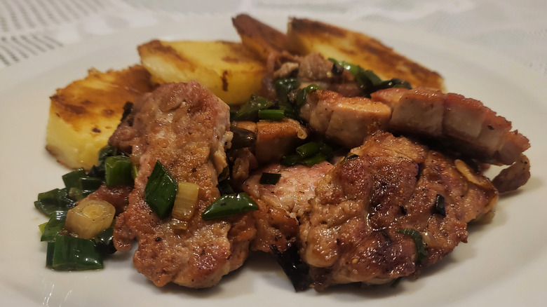 Plate of cooked sweetbreads with potatoes