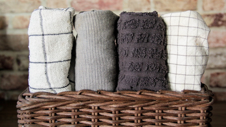 Dish cloths rolled in a basket