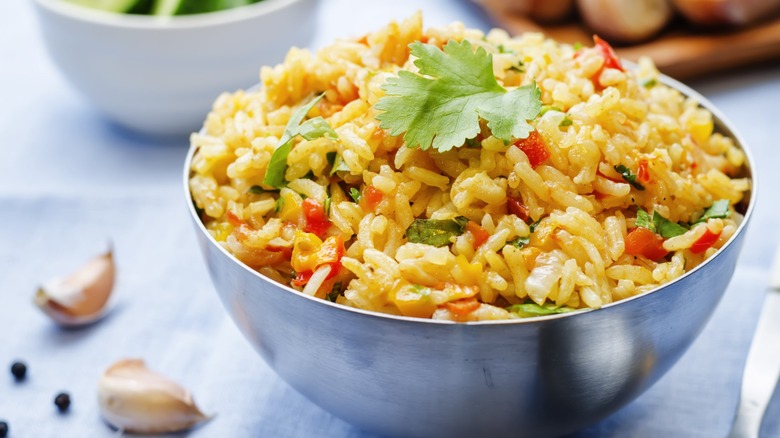 A bowl of seasoned rice with herbs
