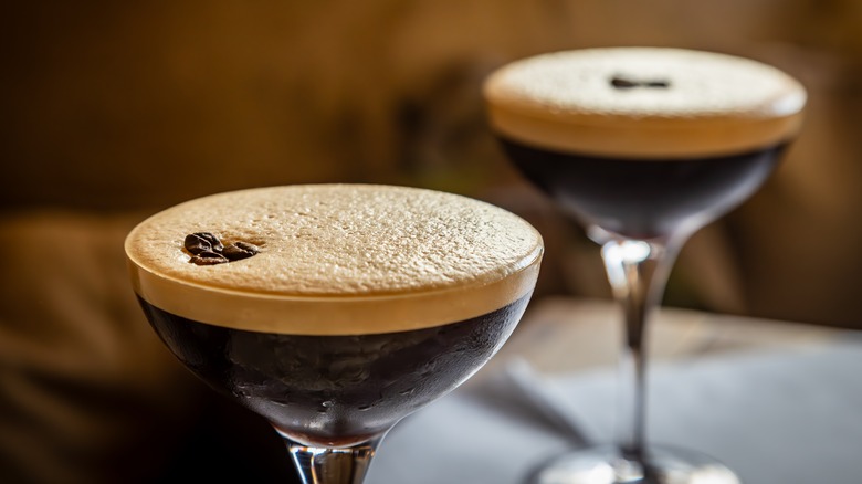 A close up on two espresso martinis in chilled martini glasses