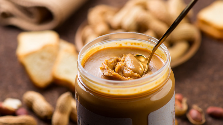 spoon in a jar of peanut butter