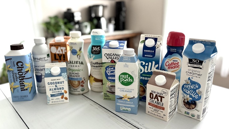 12 types of coffee creamers arranged on countertop