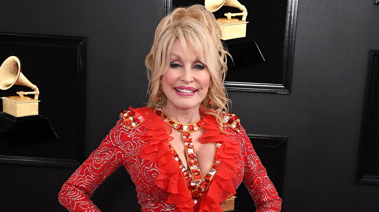 Dolly Parton smiles on the red carpet at the Grammy Awards