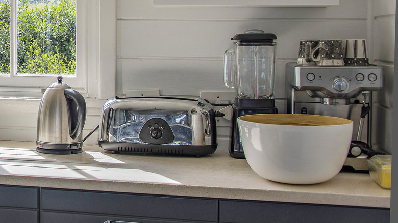 A kitchen counter with small appliances