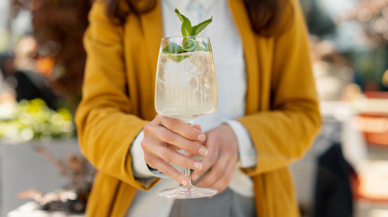 Women holding spritz in hand