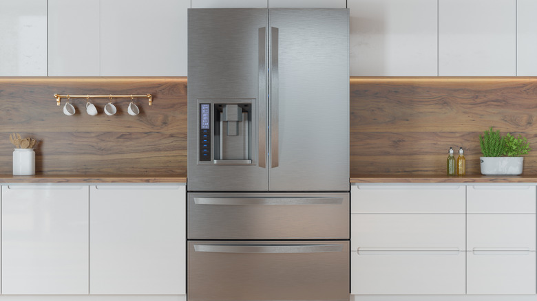 Steel refrigerator in modern kitchen