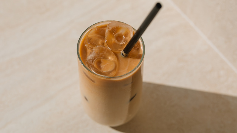 Glass of iced coffee with straw