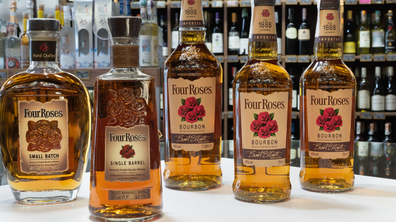 Bottles of Four Roses bourbon lined up at a liquor store