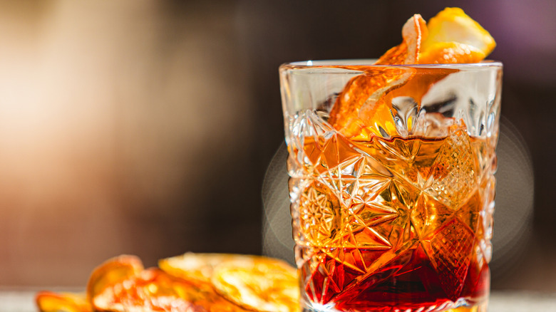 old fasioned cocktail with orange peel