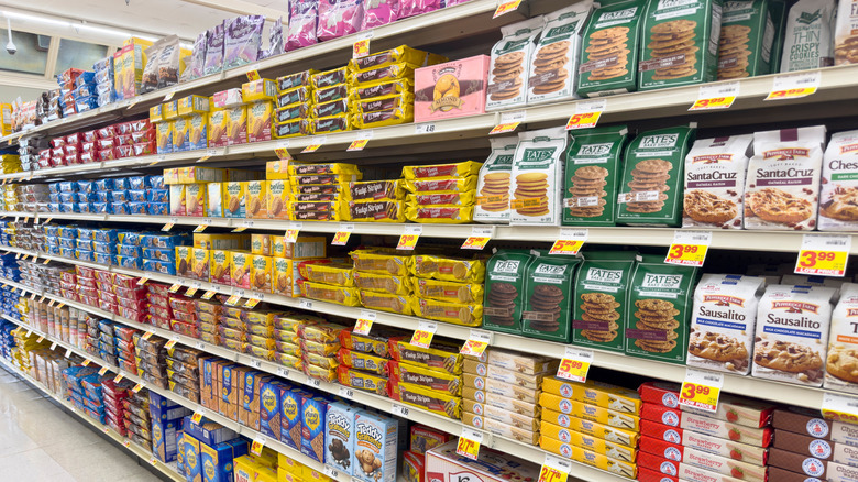 Grocery store shelves filled with different brands of cookies