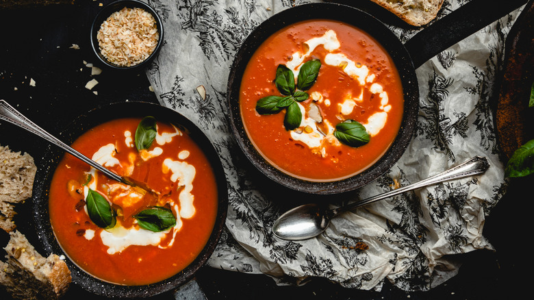 Two pots of creamy tomato soup