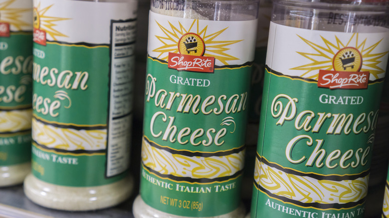Containers of grated Parmesan cheese