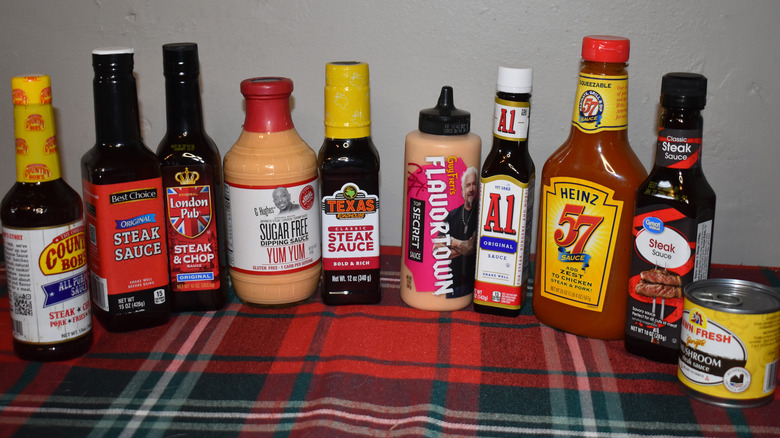 bottles of steak sauce in a line