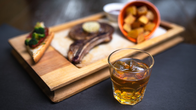 Whiskey glass with steak