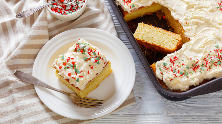 Sheet cake with a slice taken out and put on a plate