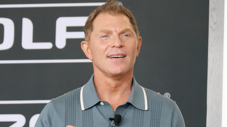 Bobby Flay speaking to an audience.