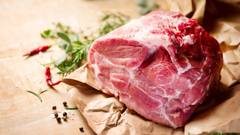 A large cut of raw pork