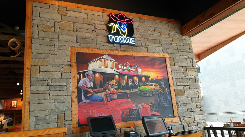 Texas roadhouse sign on front wall at restaurant