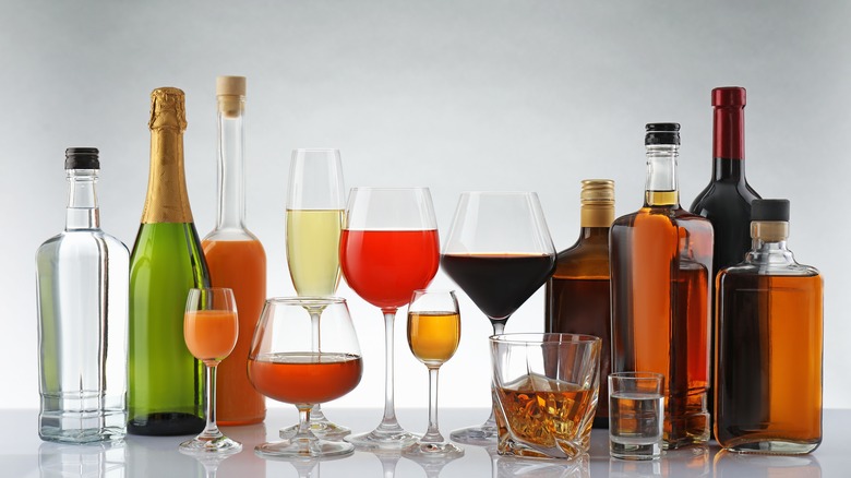 A variety of beverages sit on a table.