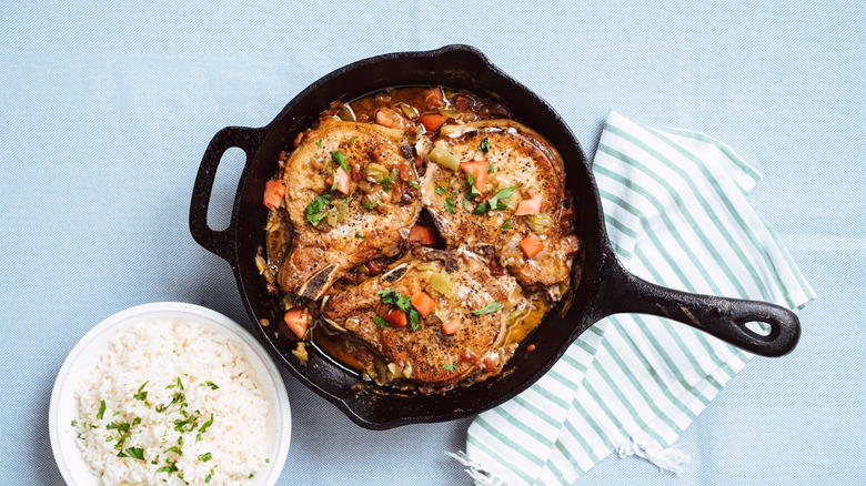 Smothered pork chops with tomatoes and green chiles
