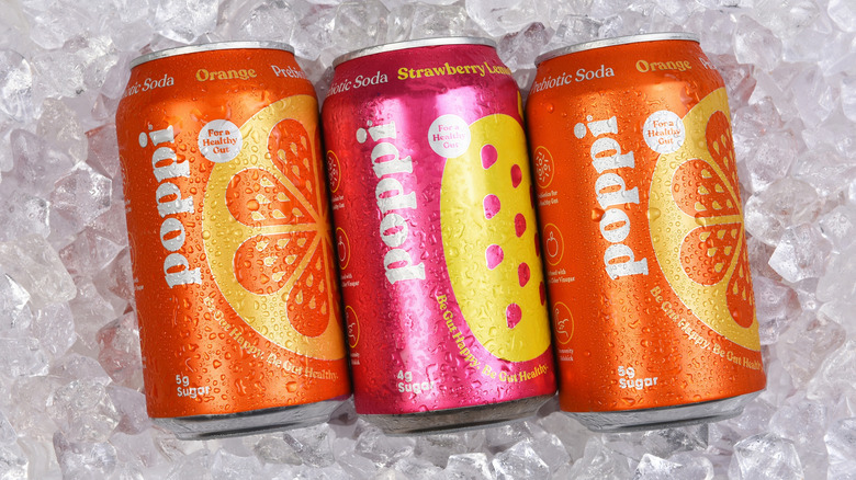 Three cans of Poppi prebiotic soda
