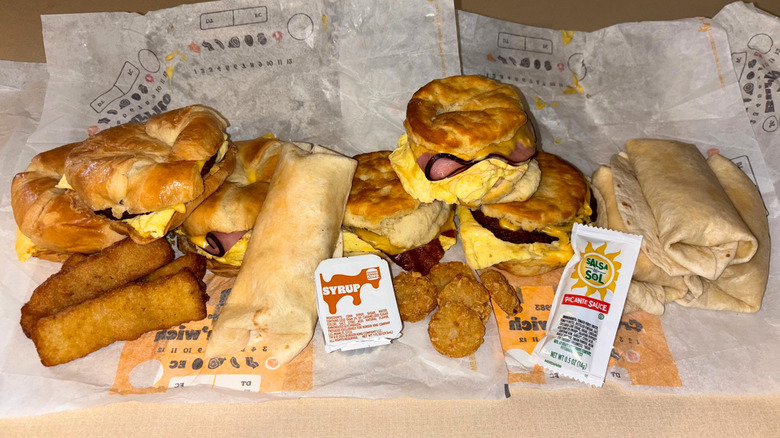 An assortment of breakfast items on a paper wrapper