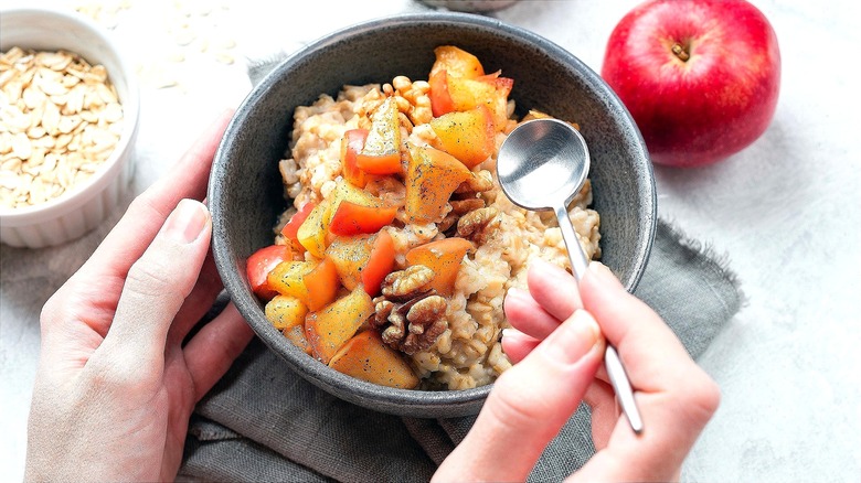 Bowl of oatmeal with caramelized apples