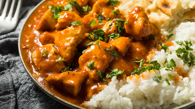 Butter chicken and rice on a plate