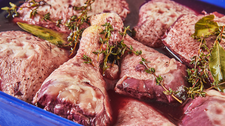 close up of chicken marinating