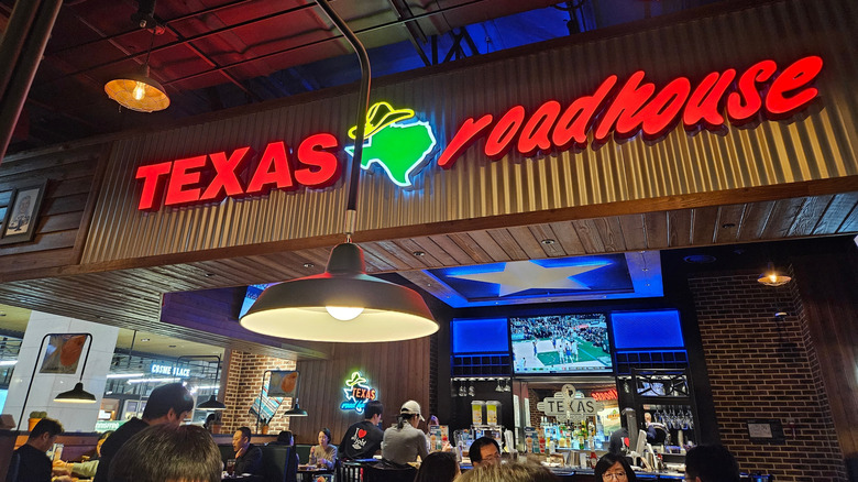 Texas Roadhouse interior bar area and sign
