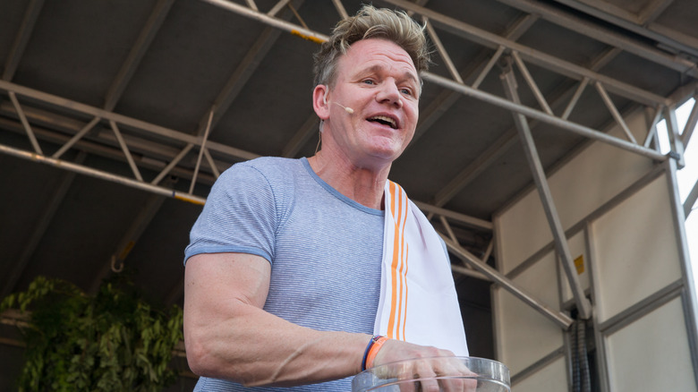 Celebrity chef Gordon Ramsay is pictured on stage at a live cooking demonstration.